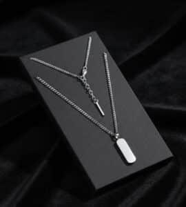 Silver necklace displayed on black background